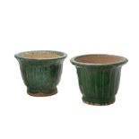 A PAIR OF GREEN GLAZED CERAMIC GARDEN POTS