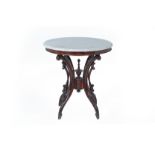 A MARBLE TOPPED CIRCULAR OCCASSIONAL TABLE