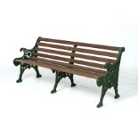 A GREEN PAINTED CAST METAL GARDEN BENCH