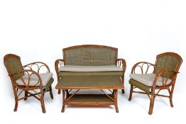 A BAMBOO CANED FOUR PIECE FURNITURE SUITE