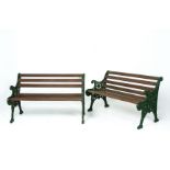 A PAIR OF GREEN PAINTED CAST METAL GARDEN BENCHES