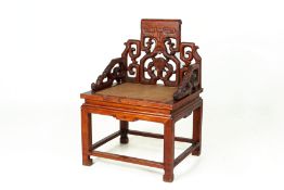 A CHINESE CARVED ARMCHAIR