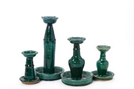 A GROUP OF SHIWAN GREEN GLAZED OIL LAMPS/CANDLE STANDS