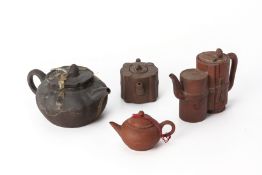 A GROUP OF FOUR YIXING POTTERY TEAPOTS