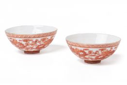 A PAIR OF SMALL IRON RED EGGSHELL PORCELAIN BOWLS