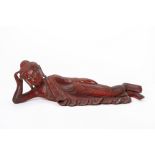 A BURMESE CARVED AND RED LACQUER RECUMBENT BUDDHA