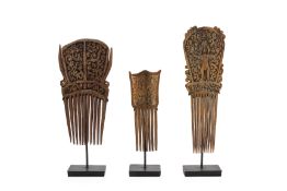 A SET OF THREE SOUTHEAST ASIAN CARVED WOOD COMBS