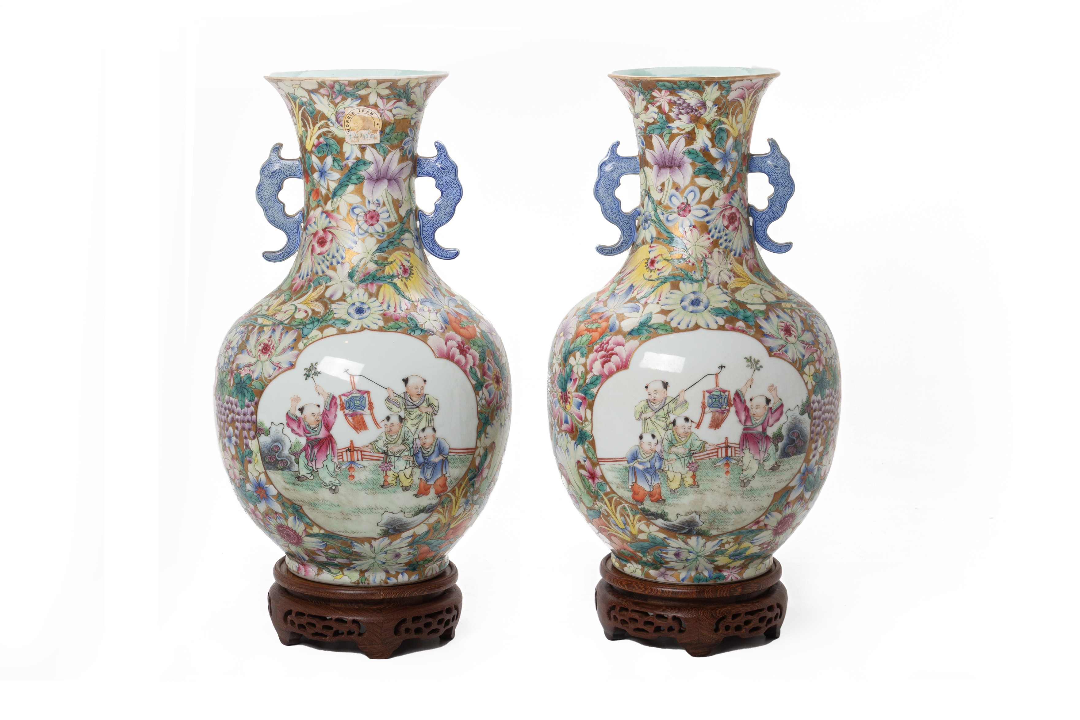 A PAIR OF TWIN HANDLED FAMILLE ROSE MILLEFLEURS VASES