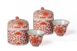 A PAIR OF IRON RED DECORATED PORCELAIN WINE WARMERS