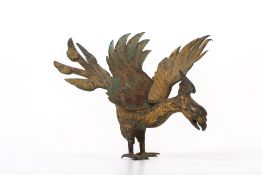 A GILT COPPER MODEL OF A MYTHICAL BIRD OF PREY