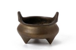 A CHINESE BRONZE TRIPOD CENSER