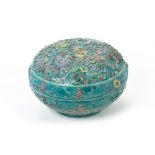 A TURQUOISE GROUND RELIEF MOULDED CIRCULAR BOX AND COVER