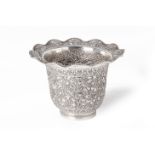 A SILVER VASE WITH WAVY RIM