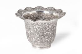 A SILVER VASE WITH WAVY RIM