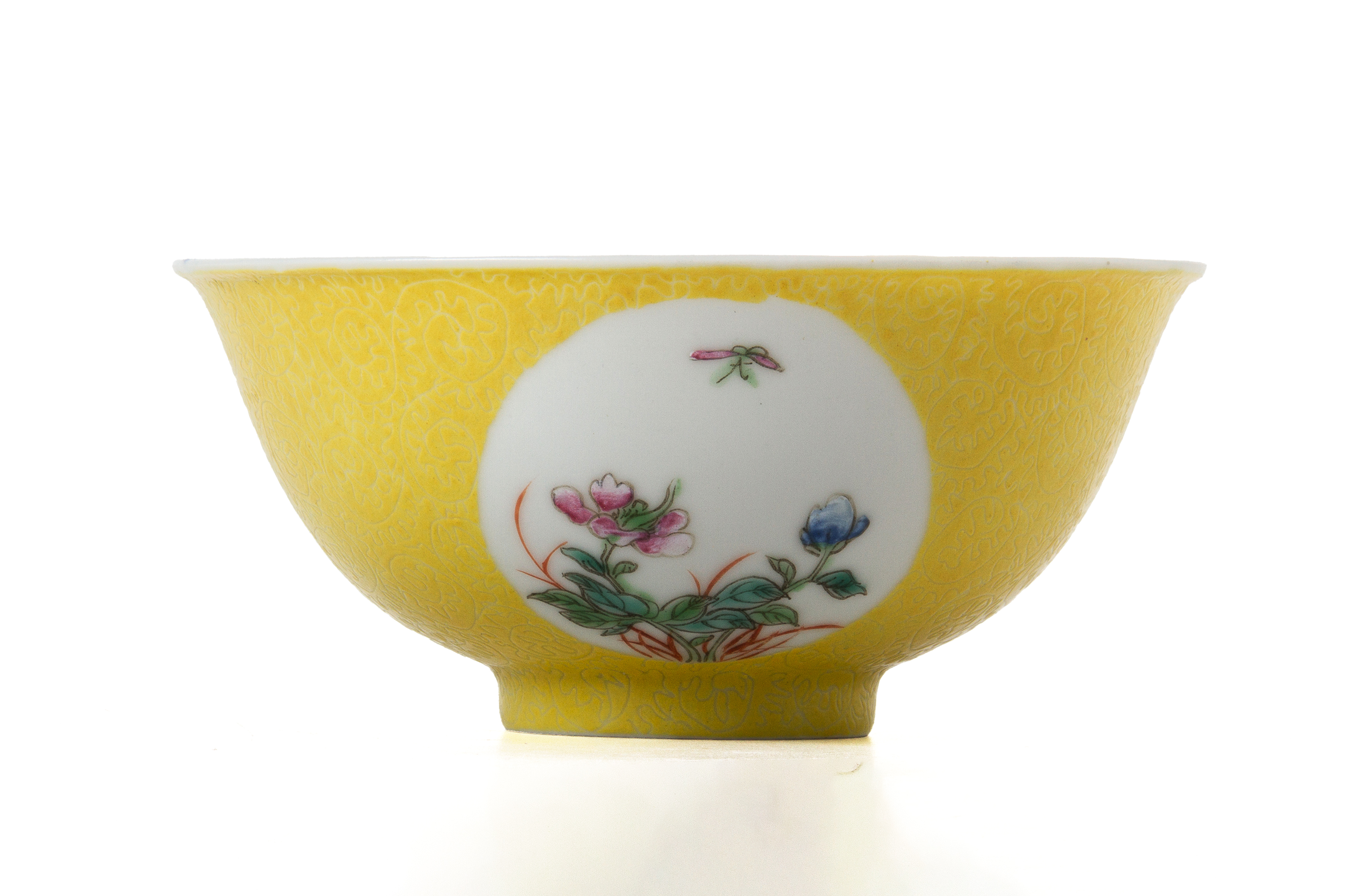 A FAMILLE ROSE YELLOW SGRAFFITO GROUND FLOWER MEDALLION BOWL