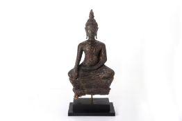 A SOUTHEAST ASIAN CARVED AND LACQUERED WOOD BUDDHA