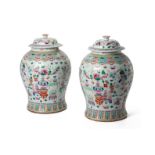 A PAIR OF FAMILLE ROSE PORCELAIN JARS AND COVERS