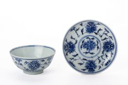 A BLUE AND WHITE LOTUS BOWL AND SIMILAR SAUCER