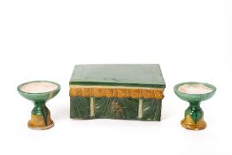 A CHINESE SANCAI GLAZED MODEL OF A TABLE AND TWO STEM CUPS