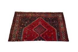 A PERSIAN SHIRAZ WOOL CARPET