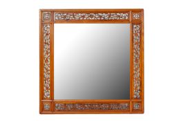 A SQUARE CARVED WOOD MIRROR