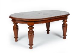 A COLONIAL STYLE TEAK EXTENDING DINING TABLE