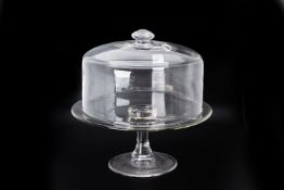 A GLASS CAKE STAND AND COVER