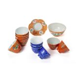 A GROUP OF CORAL RED AND BLUE SGRAFFITO PORCELAIN TEABOWLS