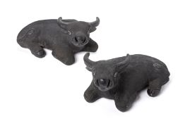 A PAIR OF CHINESE CERAMIC MODELS OF RECUMBENT OXEN