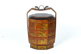 A CHINESE LACQUER THREE TIERED WEDDING BASKET