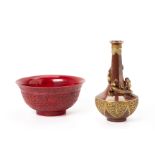 A RED MOULDED PORCELAIN BOWL AND A VASE