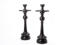 A PAIR OF LARGE METALWARE VIETNAMESE CANDLE STANDS
