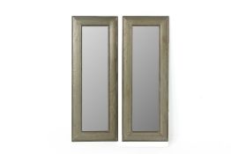 A PAIR OF METALWARE NARROW WALL MIRRORS