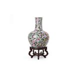 A LARGE FAMILLE ROSE BOTTLE VASE ON STAND