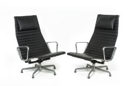 A PAIR OF EAMES DESIGN 'EA124' LEATHER LOUNGE CHAIRS