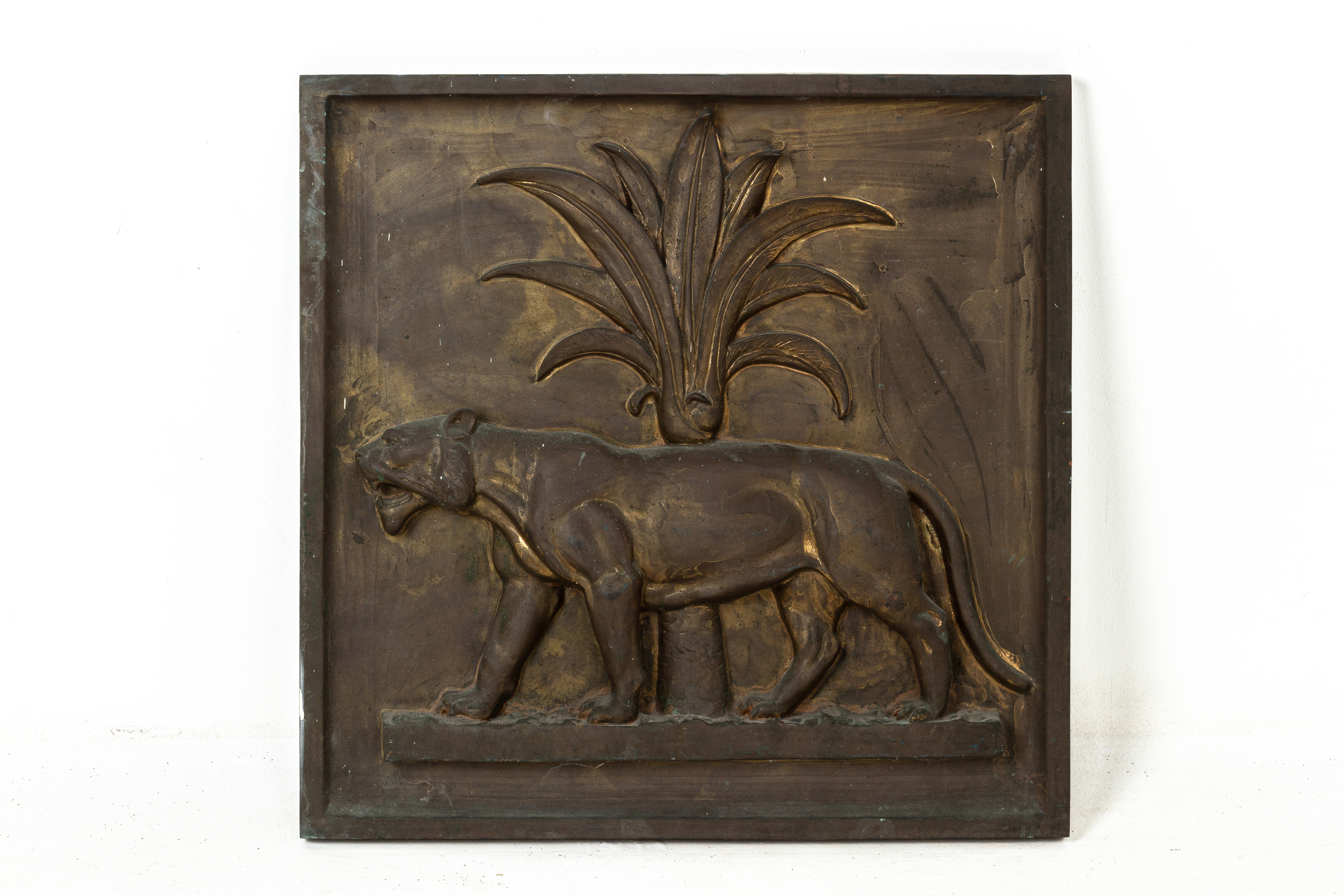 A BRONZE DECORATIVE PLAQUE