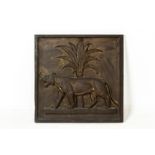 A BRONZE DECORATIVE PLAQUE