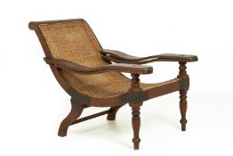 A CANED TEAK PLANTER'S CHAIR