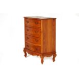 A TEAK CHEST OF DRAWERS
