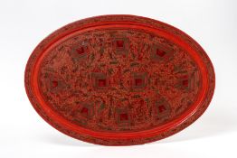 A BURMESE RED LACQUERED OVAL TRAY