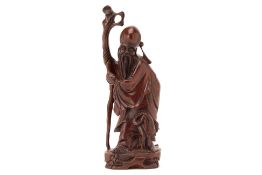 A CARVED WOOD FIGURE OF SHOU LAO