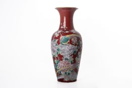 A CHINESE RED GROUND PORCELAIN VASE