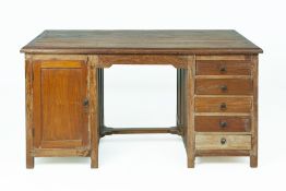 A LARGE INDIAN TEAK PARTNERS DESK