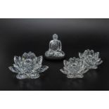 THREE SWAROVSKI LOTUS CANDLE HOLDERS AND A BUDDHA