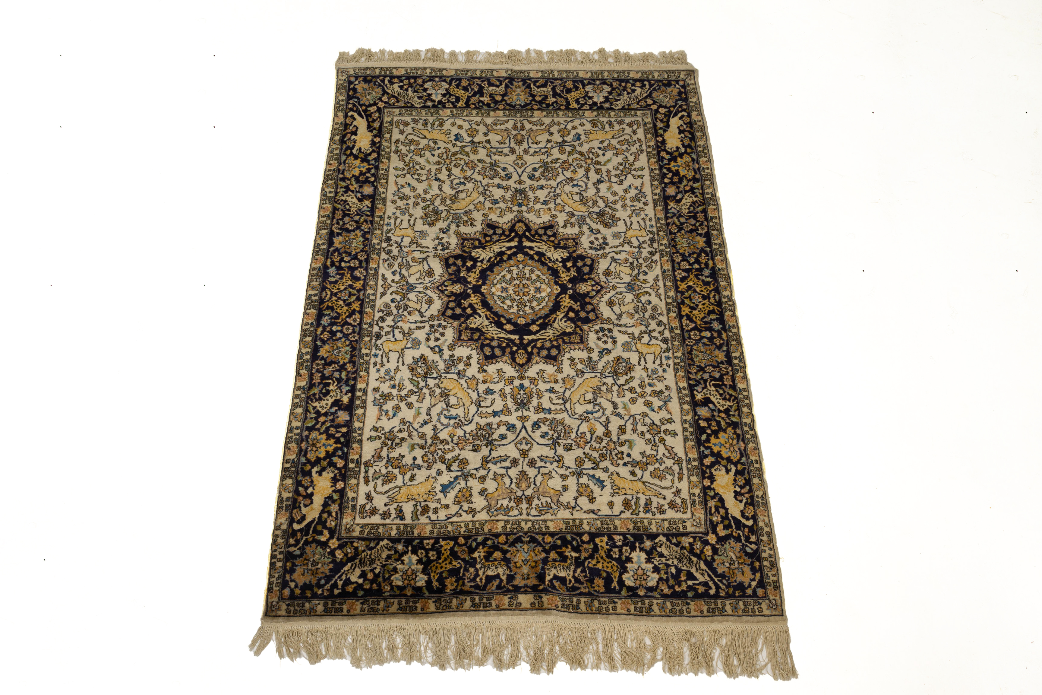 A MIDDLE EASTERN BLUE AND IVORY RUG