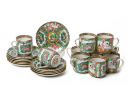 A SET OF ELEVEN CANTON FAMILLE ROSE TEACUPS AND SAUCERS