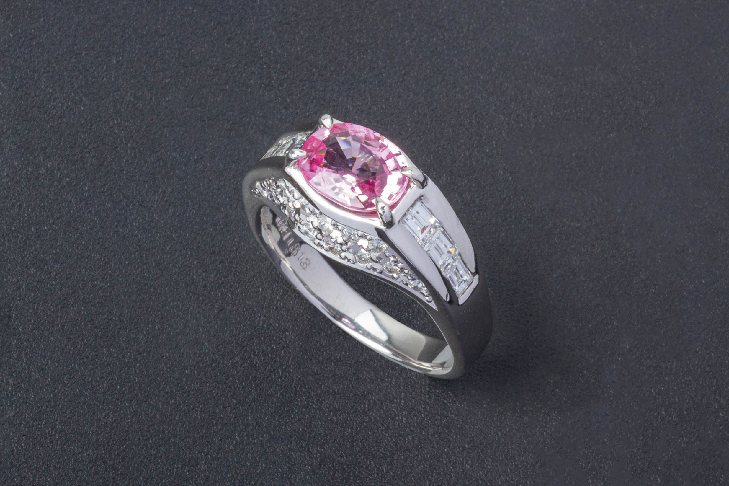 A PINK SAPPHIRE AND DIAMOND RING