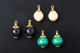 THREE PAIRS OF GOLD MOUNTED BEADS