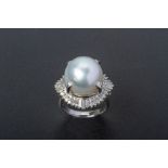 A CULTURED SOUTH SEA PEARL AND DIAMOND RING