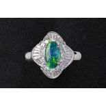 A BLACK OPAL AND DIAMOND RING